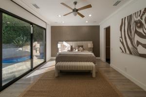 a bedroom with a bed and a ceiling fan at Valea Estate in Beverly Glen +79 photos