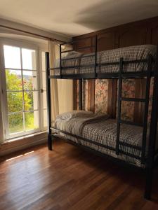 Кровать или кровати в номере TEROTERO Lake Hostel - Habitación Nahuel 1