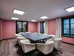 a conference room with a long table and chairs at Pullman Riga Old Town - Renovated 2025 in Rīga +180 photos
