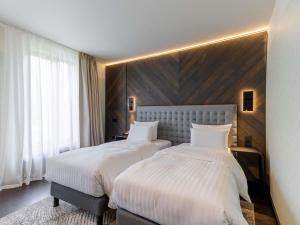 Ένα ή περισσότερα κρεβάτια σε δωμάτιο στο Pullman Riga Old Town - Renovated 2025 +194 φωτογραφίες