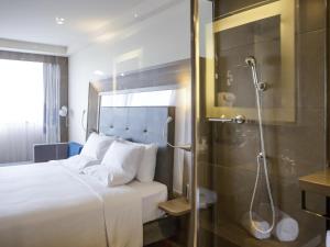 Giường trong phòng chung tại Novotel RJ Porto Atlantico
