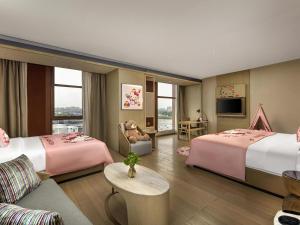 Ένα ή περισσότερα κρεβάτια σε δωμάτιο στο Novotel Shanghai Clover +150 φωτογραφίες
