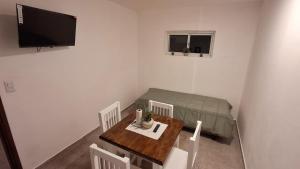 a living room with a table and a couch at La Plaza in Formosa