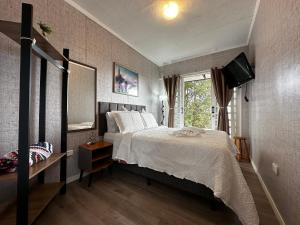 Postel nebo postele na pokoji v ubytování Container Refúgio nas Nuvens em Campos do Jordão