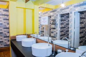 a bathroom with four sinks and a row of mirrors at Bed & Beach Hostel Karon in Ban Karon +53 photos