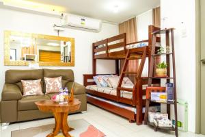 a living room with a bunk bed and a couch at Serene City Abode in Santa Rosa