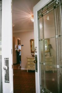 a door leading into a room with a dresser at Calmer Daze in Hot Springs +32 photos