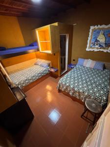 Ένα ή περισσότερα κρεβάτια σε δωμάτιο στο Posada El Arenal