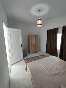 Ένα ή περισσότερα κρεβάτια σε δωμάτιο στο La Maison des Cœurs - Appart Chic