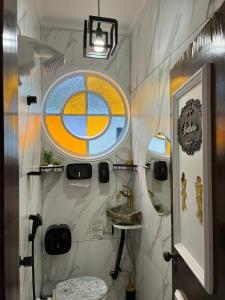 a bathroom with a round window and a sink at Morumbi Mansão 278 in Sao Paulo +112 photos