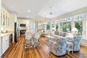 a kitchen and living room with a table and chairs at MH3012: 3012 Marsh Haven in Seabrook Island