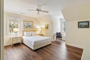 a bedroom with a bed and a ceiling fan at MH3012: 3012 Marsh Haven in Seabrook Island +79 photos