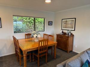a dining room with a wooden table and chairs at Entire home in Roxburgh in Roxburgh