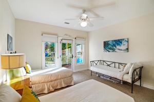 a living room with two beds and a window at SM09: 9 Silver Moss in Kiawah Island +69 photos