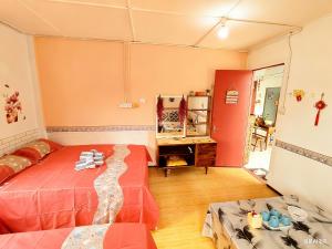 Ένα ή περισσότερα κρεβάτια σε δωμάτιο στο 玖月舒苑 +6 φωτογραφίες