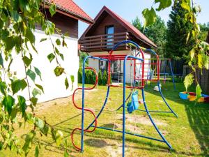 a playground in the yard of a house at 2 bedroom holiday home in Jaroslawiec in Jarosławiec