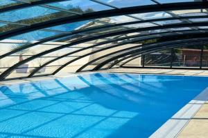 a large pool of blue water under a bridge at 2 bedroom holiday home in Jaroslawiec in Jarosławiec