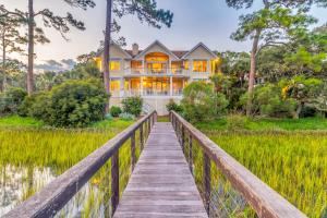 a house on a bridge over a pond at MG3083: 3083 Marshgate in Seabrook Island