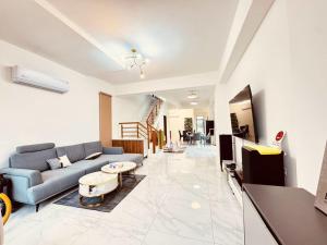 a living room with a couch and a table at 溫適民宿warmth in Zhuangwei