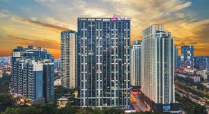 a group of tall buildings in a city at Echarm Hotel Nanning the MixC Dongmeng Business District in Nanning