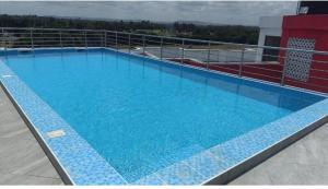 a large swimming pool on top of a building at Terry's Haven with AC in Mombasa