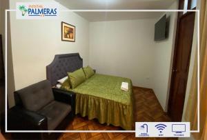 a small bedroom with a bed and a chair at Hostal Palmeras Tacna in Tacna