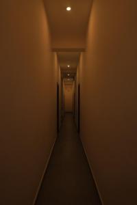 an empty hallway with a long corridor at Magesh Residency in Jāmb +1 photo