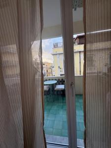 a sliding glass door with a view of a balcony at RighePois in Reggio di Calabria