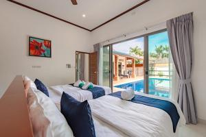 Ένα ή περισσότερα κρεβάτια σε δωμάτιο στο Orchid Pool Villa Rawai +95 φωτογραφίες