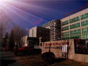 a building with writing on the side of it at GreenTree Inn Beijing East Yizhuang District Second Kechuang Street Express Hotel in Beijing