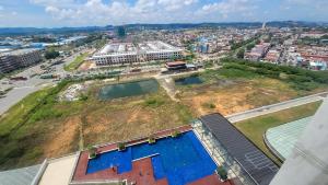 an aerial view of a city with a building at Palam Mansion at Meisterstadt Pollux Habibie Apartment in Batam Center