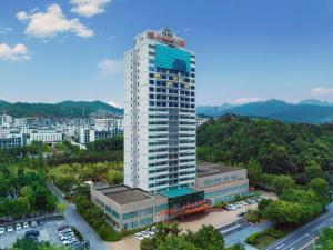an overhead view of a tall white building at Yichang Three Gorges Project Hotel in Yichang