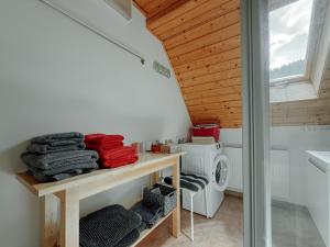 a laundry room with a washer and a washing machine at Pension Talblick in Baiersbronn +141 photos