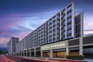 a rendering of a building with a road in front of it at AURAYA BY SUNING NANJING XUZHUANG in Nanjing