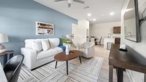 a living room with a couch and a table at Landing Apartments Austin - Lockhart in Lockhart