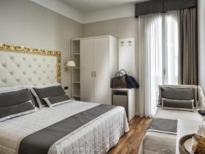 Et rom på Novecento Suite Hotel