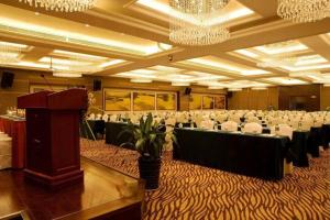 a conference room with tables and chairs and a podium at Xian Yohol Hotel in Xi'an +224 photos
