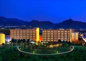 a group of buildings in a city at night at PARK INN KUNMING AIRPORT in Kunming