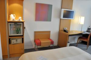 Télévision ou salle de divertissement dans l'établissement Novotel Andorra