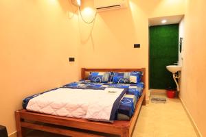 Postel nebo postele na pokoji v ubytování Le Sunrise Residency