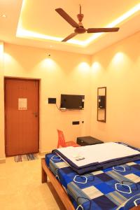 TV a/nebo společenská místnost v ubytování Le Sunrise Residency