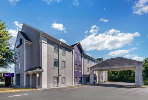 an empty parking lot in front of a building at Sleep Inn in Manassas