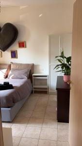 Ένα ή περισσότερα κρεβάτια σε δωμάτιο στο La casa di Mery Sun
