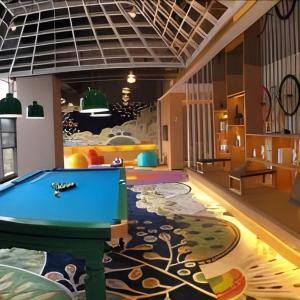 a room with a pool table on a rug at ibis Styles Kunming Nanping Hotel in Kunming
