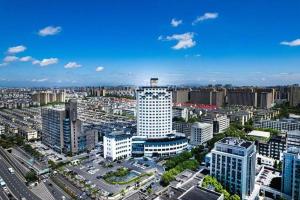 an aerial view of a city with tall buildings at Huading International Hotel in Hangzhou