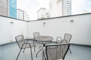 a table and chairs in a room with buildings at 구로 서울 인 호텔 in Seoul +8 photos