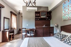 A bed or beds in a room at Poseidon Hotel