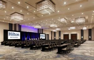 a conference room with chairs and a stage in it at Hilton West Palm Beach in West Palm Beach +80 photos
