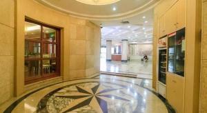 a lobby with a star on the floor of a building at 7 Days Premium Zhuhai Gongbei Light Railway Branch in Zhuhai