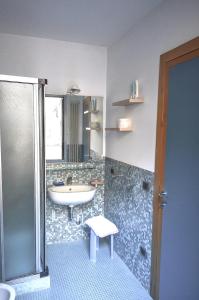 a bathroom with a sink and a shower and a sink at San Rocco Apartment in Venice